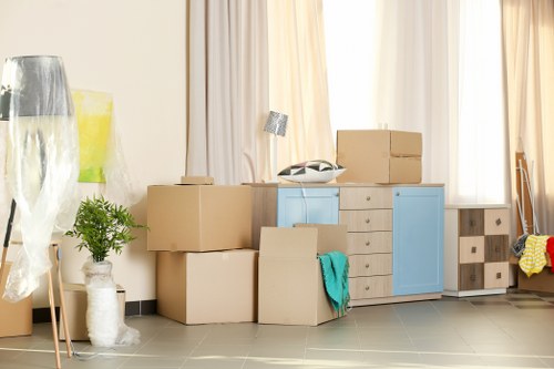 House movers handling a residential move on a busy Whitechapel street