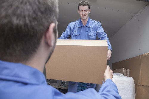 Removal van and packed boxes ready for a move in Whitechapel