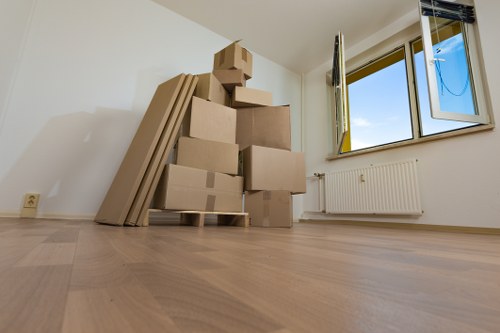 Furniture being carefully moved through a Whitechapel property entrance
