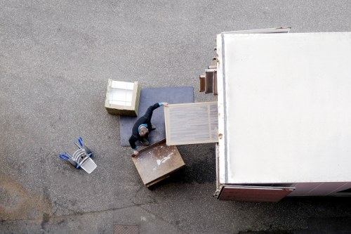 Moving team navigating stairs in a Whitechapel apartment building